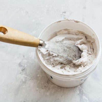 metal-spatula-in-pot-with-putty-2021-08-26-23-03-23-utc-720x480